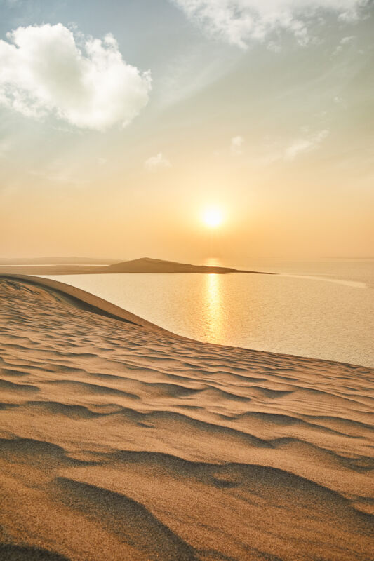 See the Sunrise In The Arabian Sea From the Sand Dunes of Inland Sea